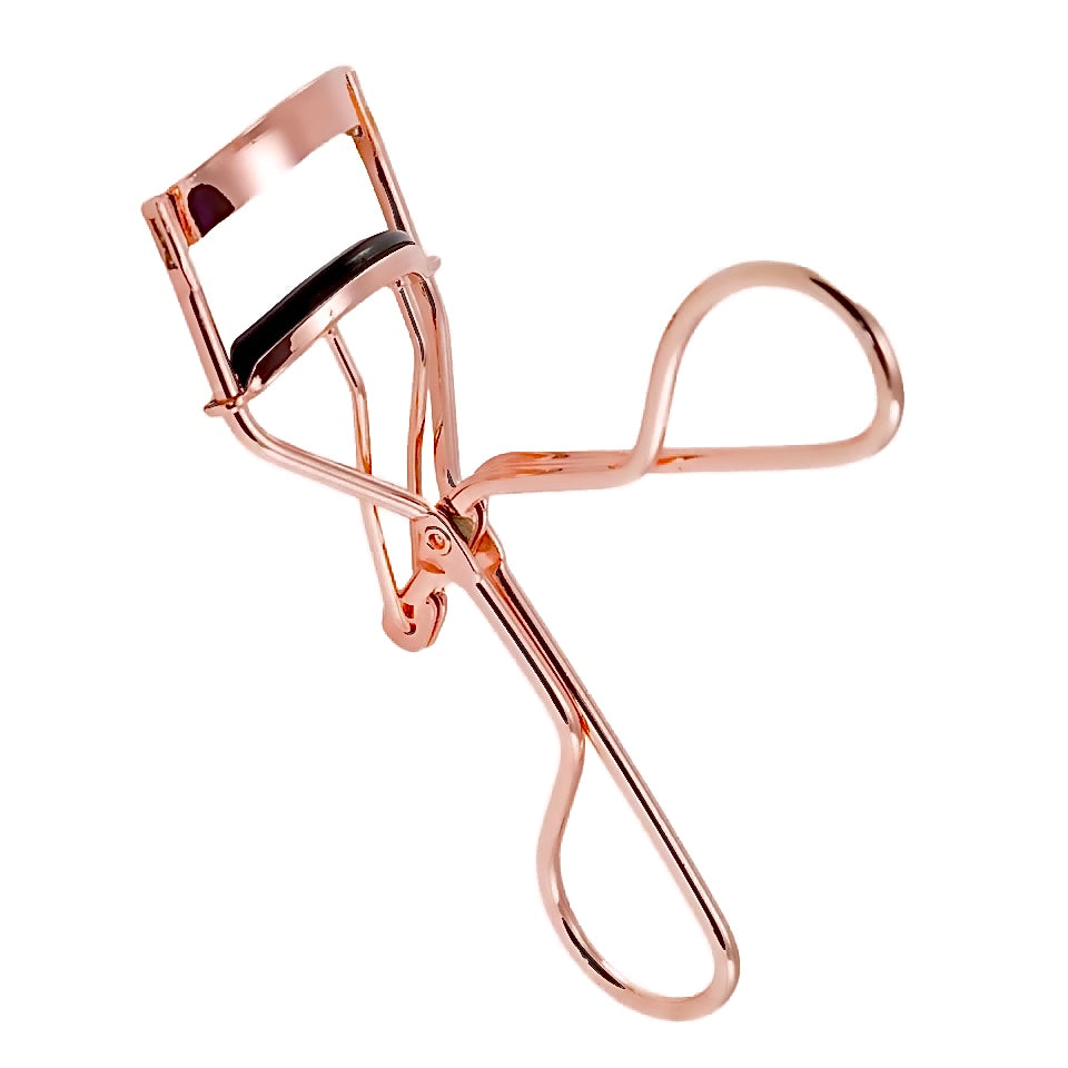 Rose gold metal eyelash curler.